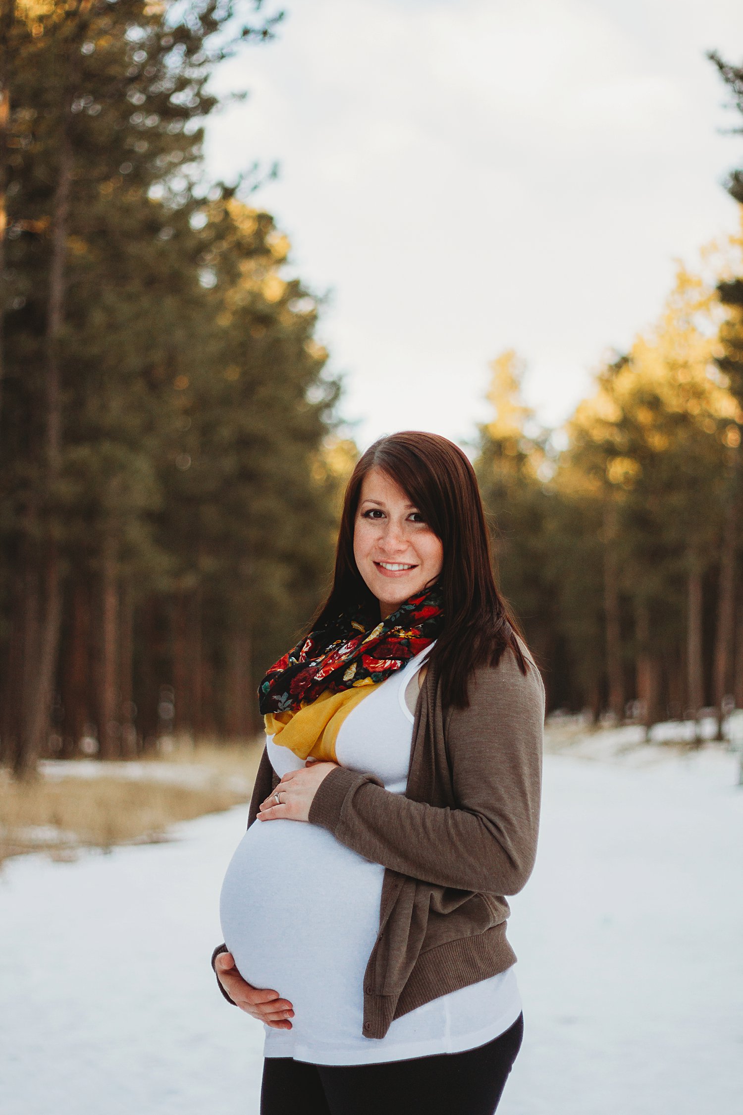 Woman holding pregnant belly