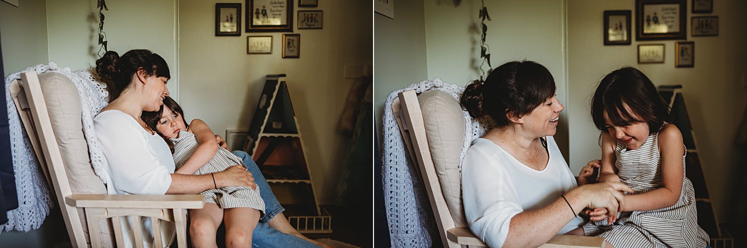 Mom and daughter snuggling and laughing in chair