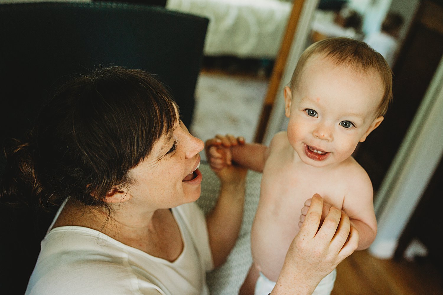 Mom snuggles with baby boy in her lap