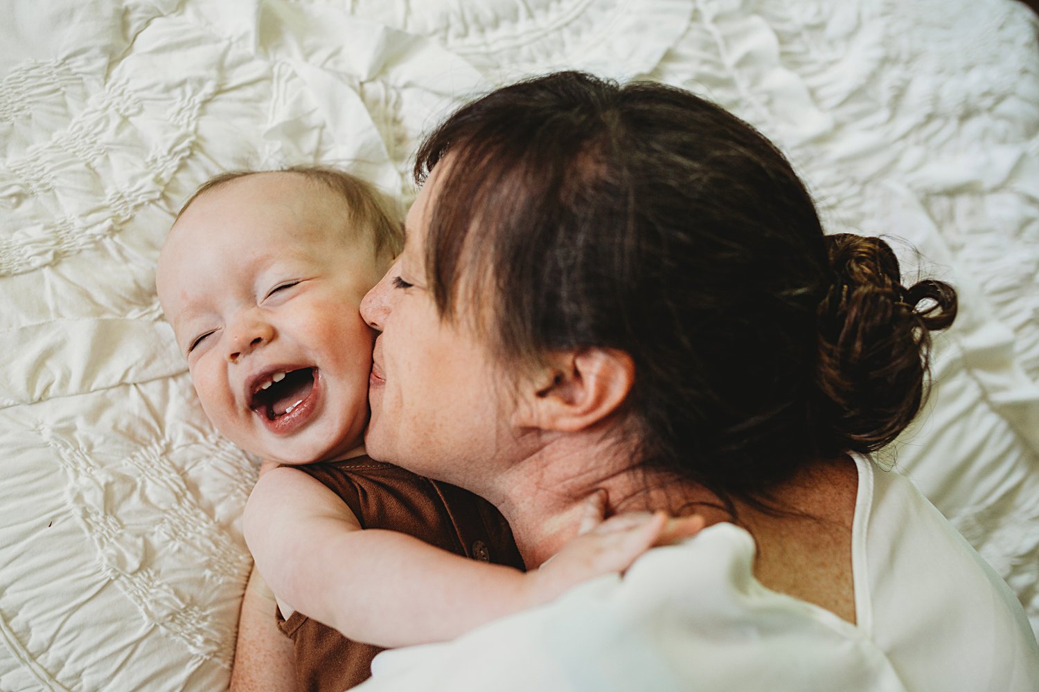 Mom kisses baby boy