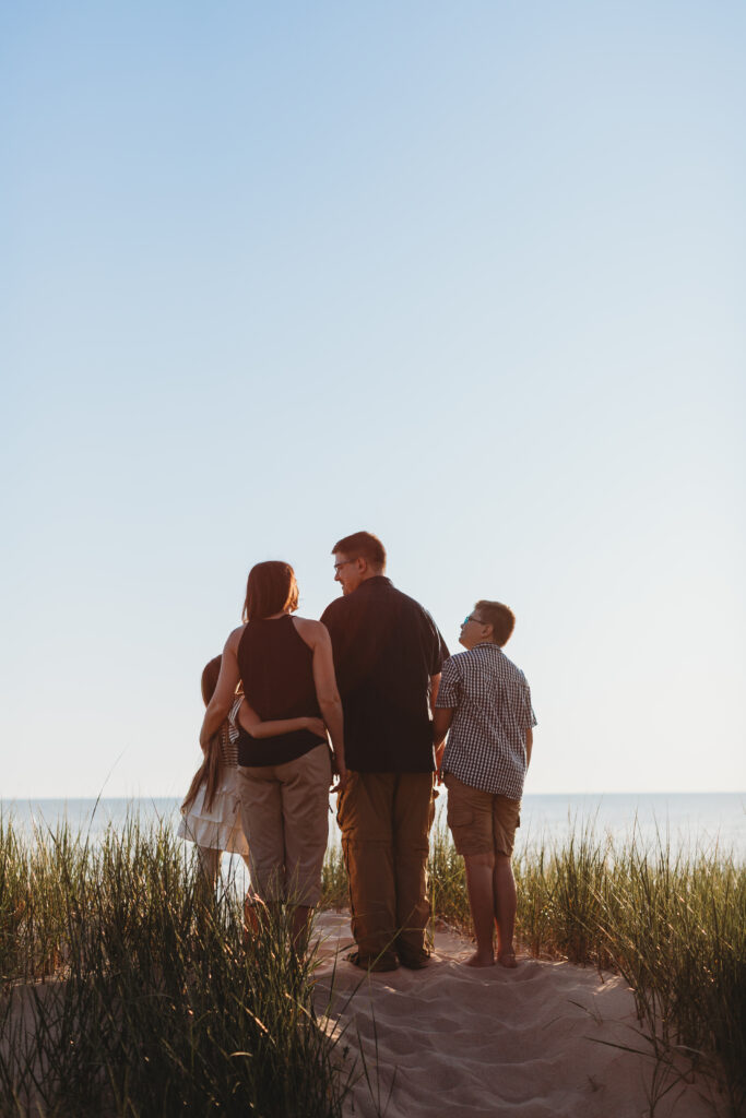 Family standing in grasses at Lake Michigan